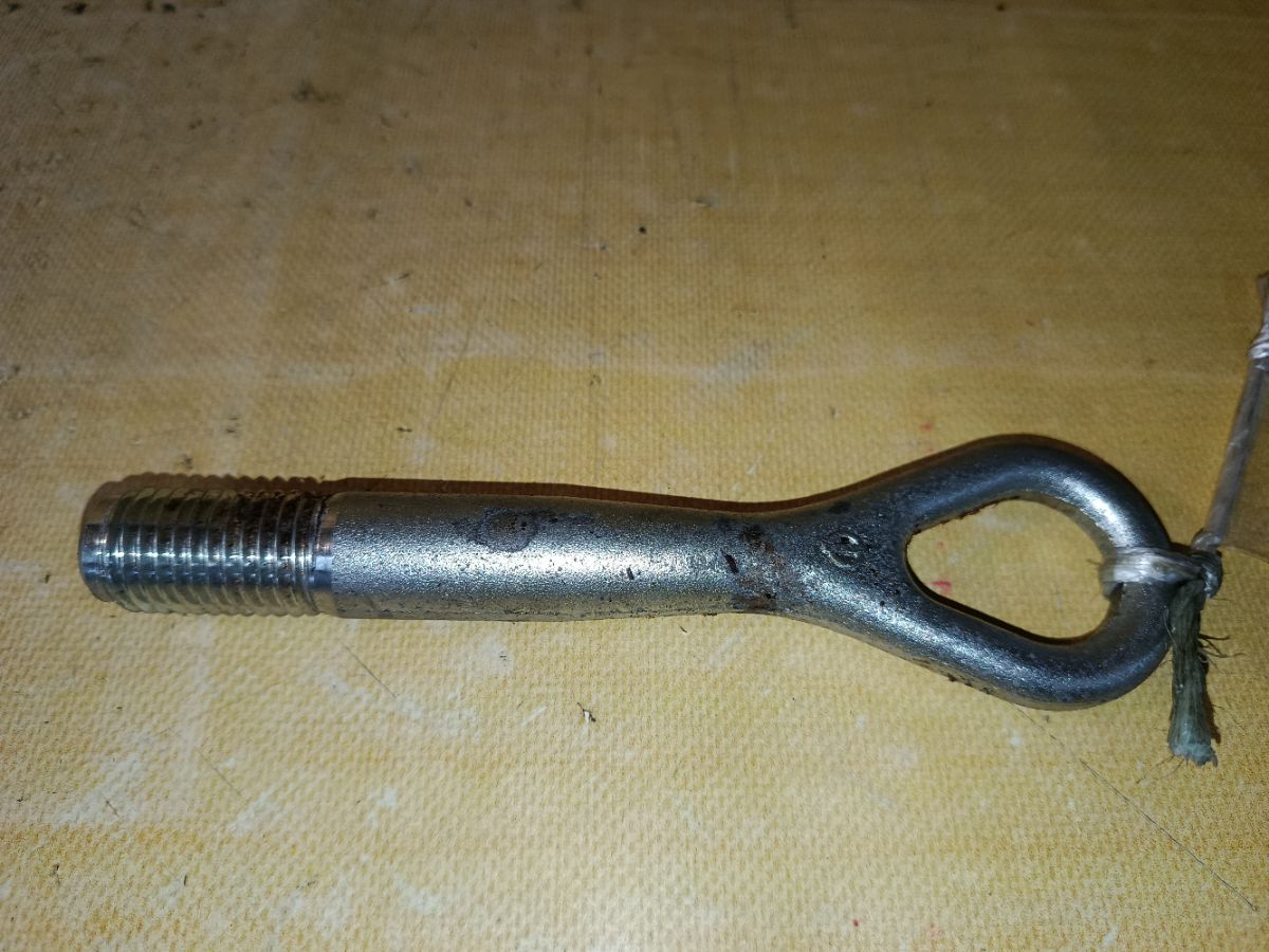 Крюк буксировочный 51112-1KA0A, 51112-AC700, 51112-AC70A на Nissan Note E12 Фото 1