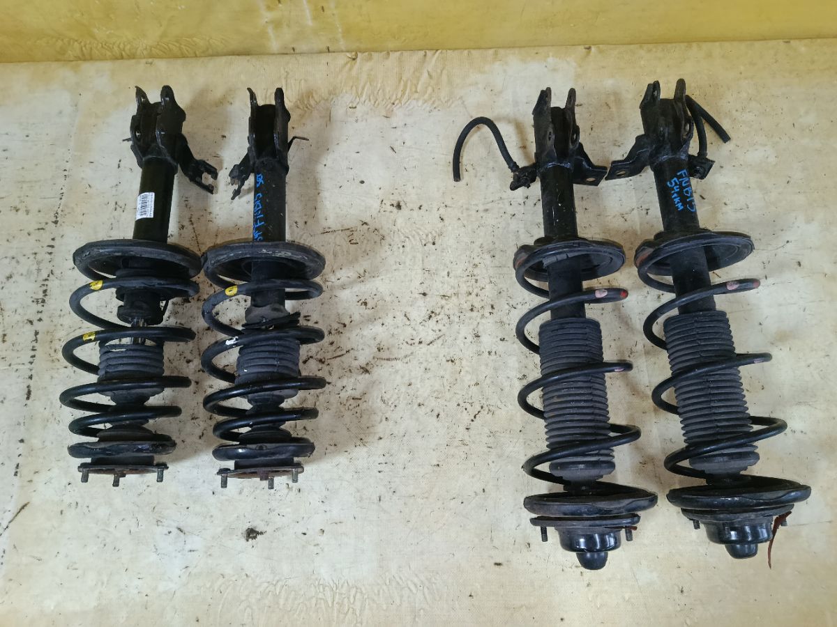 Стойка амортизатора на Nissan Sunny FNB15 QG15DE Фото 1