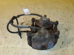 Суппорт на Nissan Sunny FNB15 QG15DE, Переднее расположение