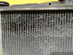 Радиатор ДВС 01163028, 10-26844-SX, 104855, 119084, 140055N, 2064029, 248158F, 248158J, 248158R, 248158U, 248180U, 28200, 314347, 32002200, 37855, 522200R, 526908-2, 5269082K, 53686, 60322200, 68158, 734197, 8010-306, 8MK 376 753-671, ADC49847, ARD1443, C557-39, CR 1073 000S, DA36935, DAP369035, DCM2526, JPR0110, LRC 11172, MBPIN99-910, MBPIN99-911, MBPIN99910, MC-H77W-1216, MC00012, MC00012-2R, MMC012, MR373172, MR373172-N2, MR373172-R1, MR431239, MR464810, MR571562, MT2200, PL031281, PL031281R, PL031282, PRD1443, STMC00012, TD-036-0021, VCS4197, WG1722514 на Mitsubishi Pajero Io H76W 4G93 Фото 2