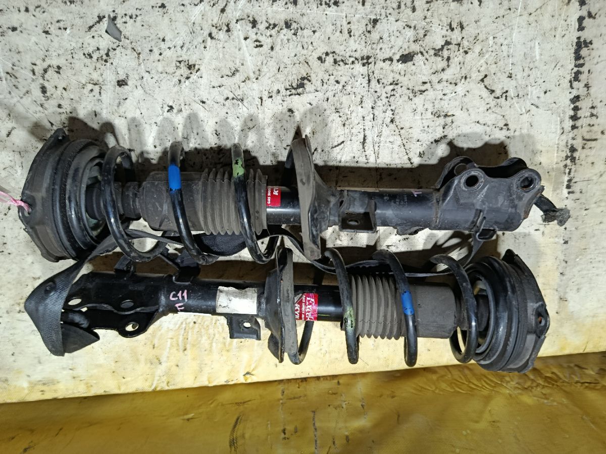 Стойка амортизатора на Nissan Tiida C11 HR15DE Фото 1