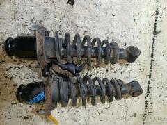 Стойка амортизатора на Toyota Corolla Fielder NZE144G 1NZ-FE, Заднее расположение